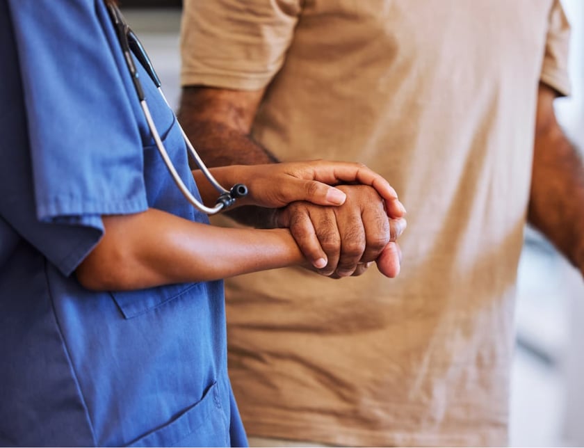 caregiver_holding_patients_hand