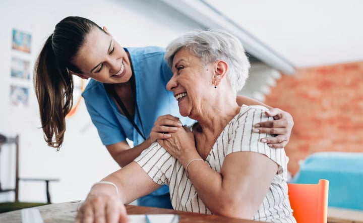 home_care_professional_hugging_senior_patient